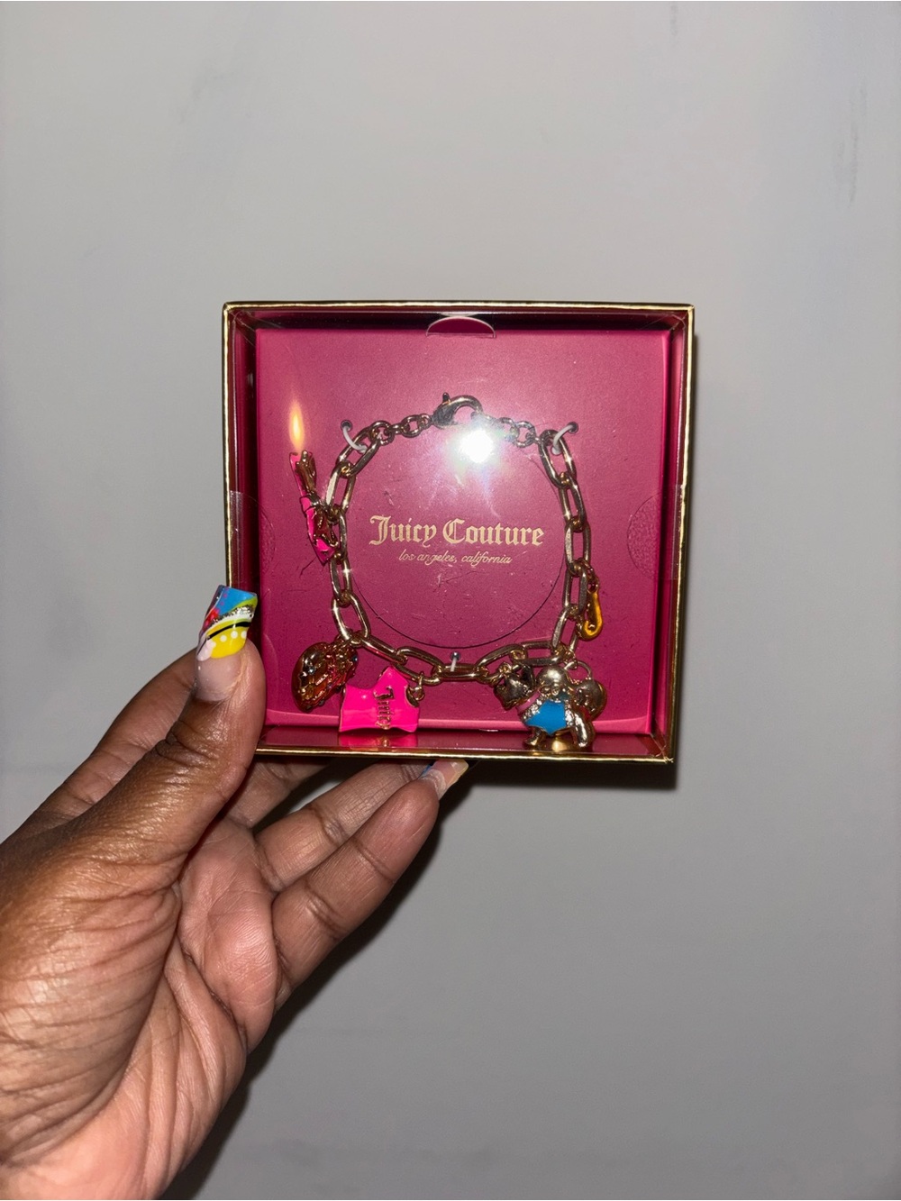 Juicy Couture Gold-Tone Charm Bracelet with Pink & Blue Charms